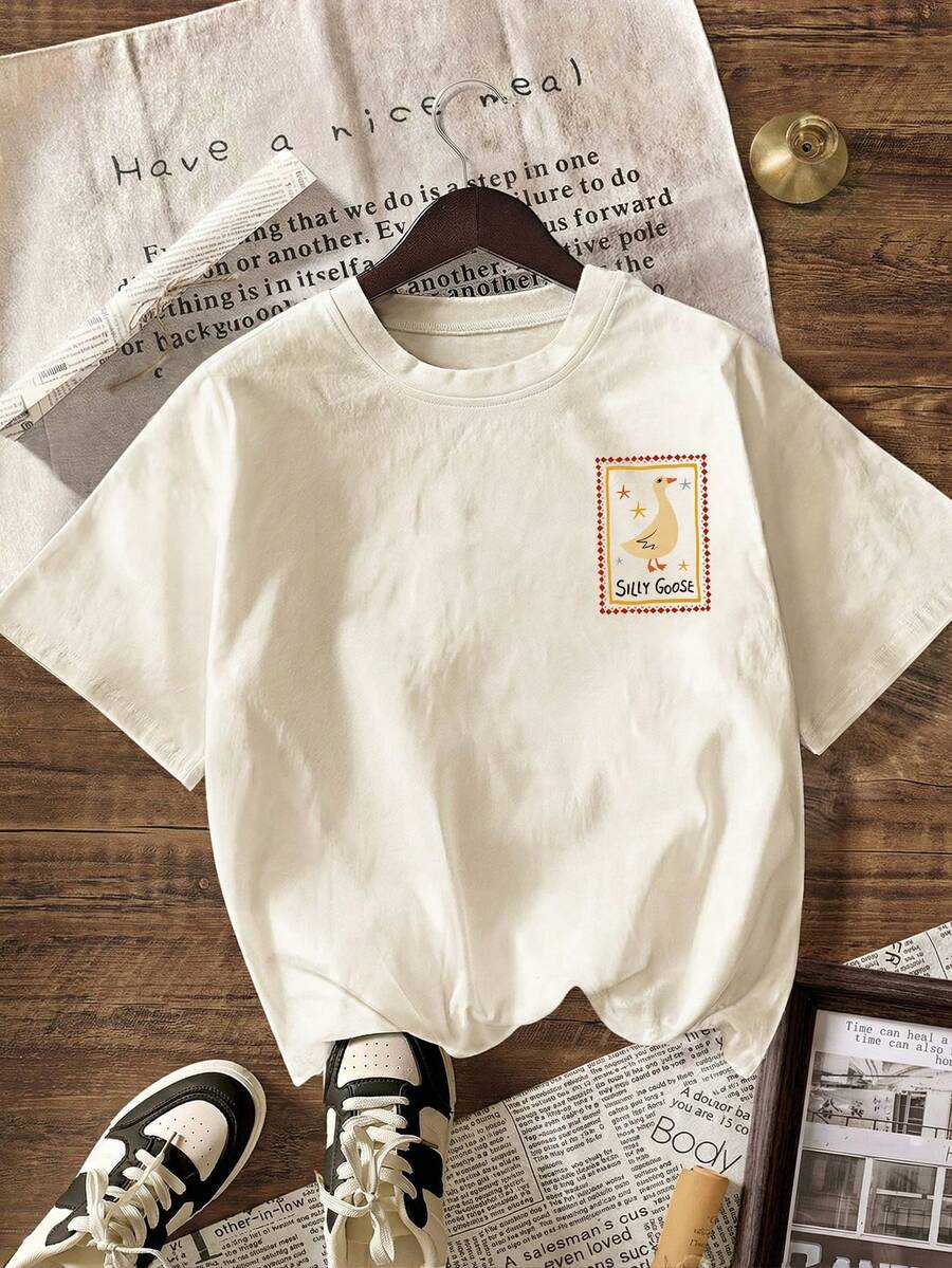 Effortless style meets comfort in this casual graphic tee designed for warm-weather wear. Featuring a classic round neckline and short sleeves, it's the perfect layering piece or standalone essential for your summer wardrobe. The relaxed fit flatters all body types while the quality fabric keeps you cool throughout the day. Pair it with jeans, shorts, or a skirt for an instantly put-together look that works from casual outings to weekend adventures.