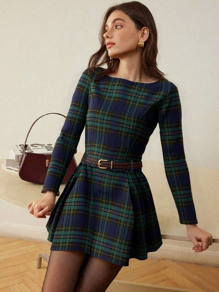 Front lifestyle view of navy and green plaid long-sleeve mini dress with flared A-line skirt