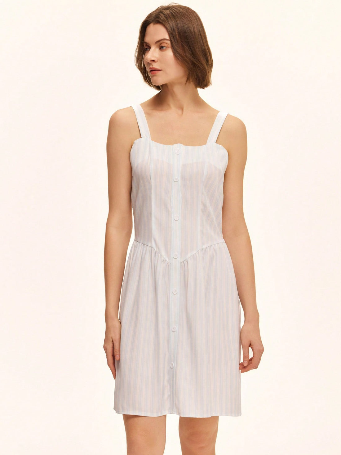 This playful green sleeveless summer dress is perfect for casual days under the sun. Featuring a solid color and a charming front button closure, it offers easy wear and a breezy feel. Its simple yet stylish design makes it a go-to choice for warm weather fun and effortless style.