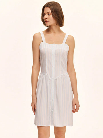 This playful green sleeveless summer dress is perfect for casual days under the sun. Featuring a solid color and a charming front button closure, it offers easy wear and a breezy feel. Its simple yet stylish design makes it a go-to choice for warm weather fun and effortless style.