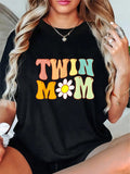 Get ready to be a groovy twin mama with this hilarious Mother's Day t-shirt! Perfect for new moms of twins, this shirt will make you stand out while also showing off your sense of humor. Grab one for yourself or give as a gift to a fellow twin mama.