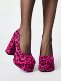 Front view of hot pink leopard print platform pumps with chunky heels