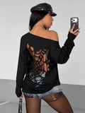 Back view of black off-shoulder long sleeve top with large spiderweb hollow-out detail