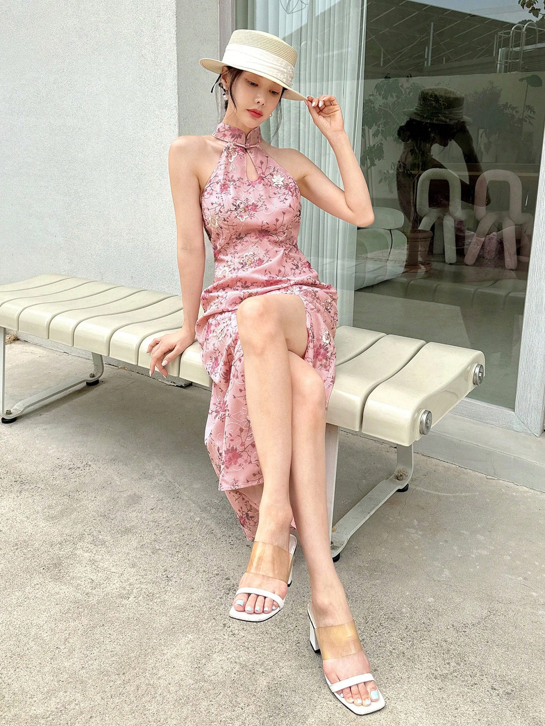 Turn heads effortlessly in this halter neck dress featuring a bold allover print and a daring thigh-high split. Its backless design adds a cheeky touch, perfect for evenings when you want to feel both flirty and fabulous. Flowing and fun, this dress lets you show off your confidence with every step.