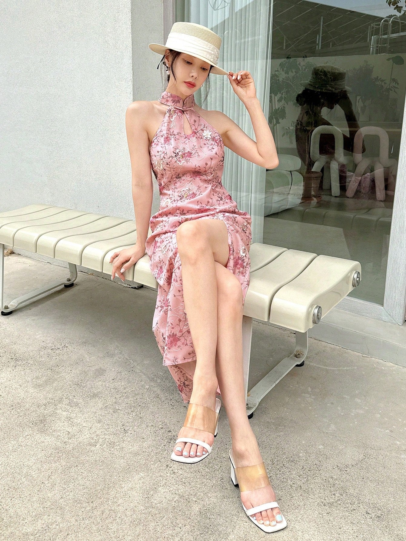 Turn heads effortlessly in this halter neck dress featuring a bold allover print and a daring thigh-high split. Its backless design adds a cheeky touch, perfect for evenings when you want to feel both flirty and fabulous. Flowing and fun, this dress lets you show off your confidence with every step.