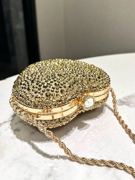 Add a touch of glamour to your outfit with our Sparkle & Shine Mini Rhinestone Clutch Bag. This elegant accessory is perfect for glamorous nights out. The mini size allows for maximum portability while the rhinestone design adds a touch of sparkle to any outfit. Elevate your style with this must-have accessory.