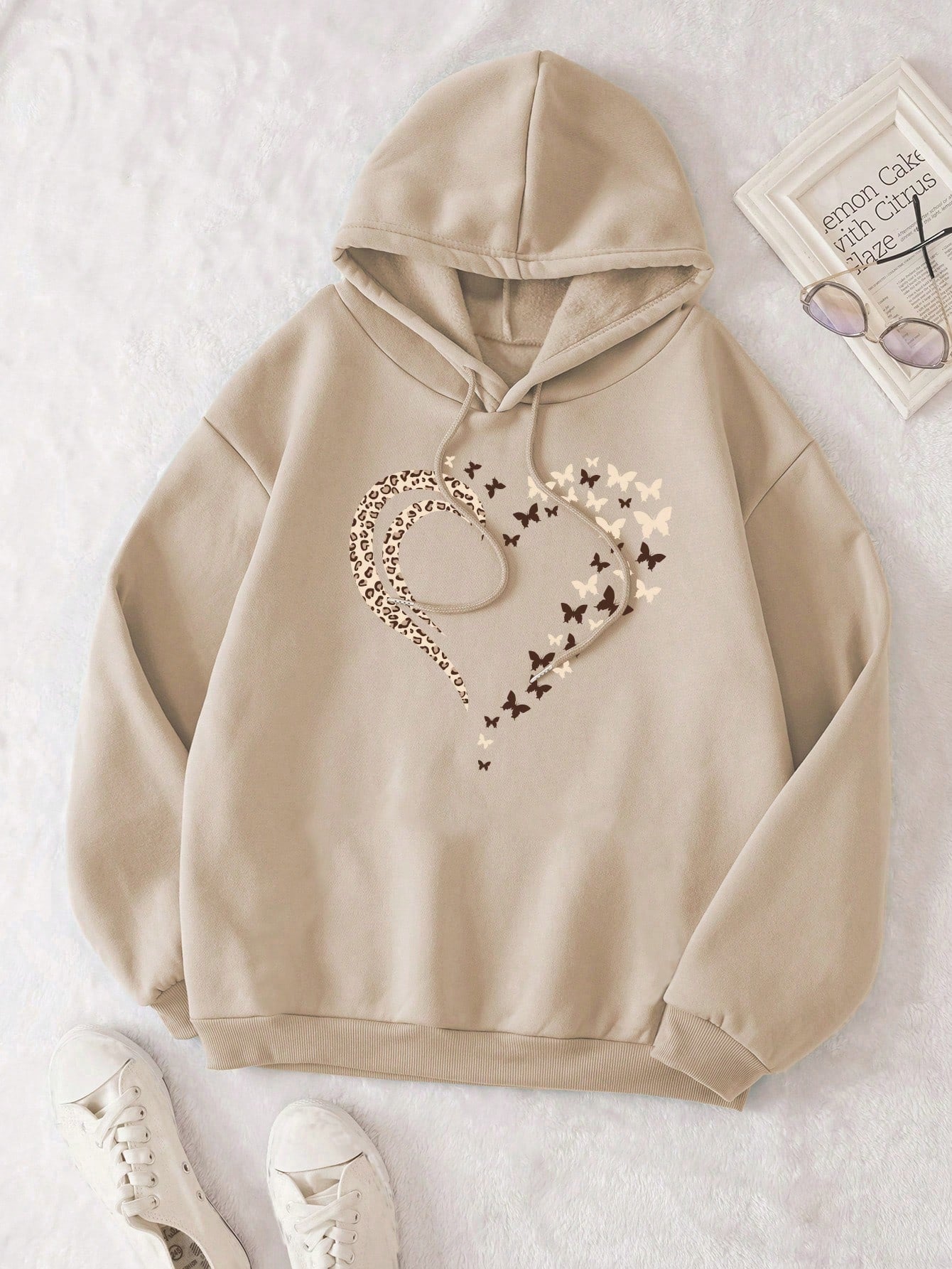 Stay cozy and stylish this winter with our Heart & Butterfly Print Plus Size Thermal Hoodie. The thermal material will keep you warm, while the heart and butterfly print adds a touch of whimsy to your outfit. Perfect for those looking for a fun and comfortable option for the colder months.