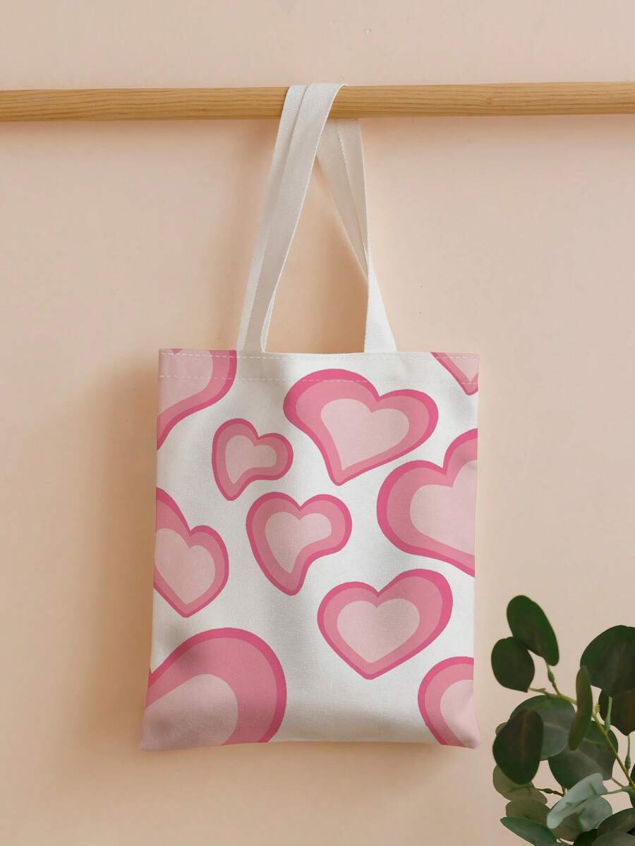 Carry your essentials in style with this charming heart print shopper bag. Designed for teen girls and women, this spacious tote features a playful heart pattern that adds personality to any outfit. Perfect for school, shopping trips, or everyday adventures, the roomy interior keeps your belongings organized and accessible. Durable construction ensures it withstands daily wear, while the comfortable handles make carrying effortless.