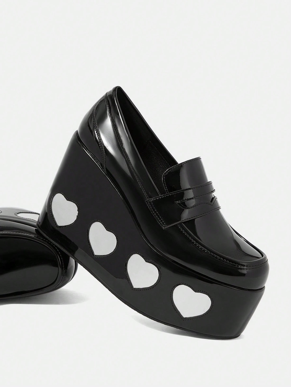 Elevate your style and comfort with our Heart Print Wedge Slip-Ons. Designed for the great outdoors, these shoes feature a heart print design and a comfortable wedge heel for added support. Stay both stylish and comfortable on your next adventure.