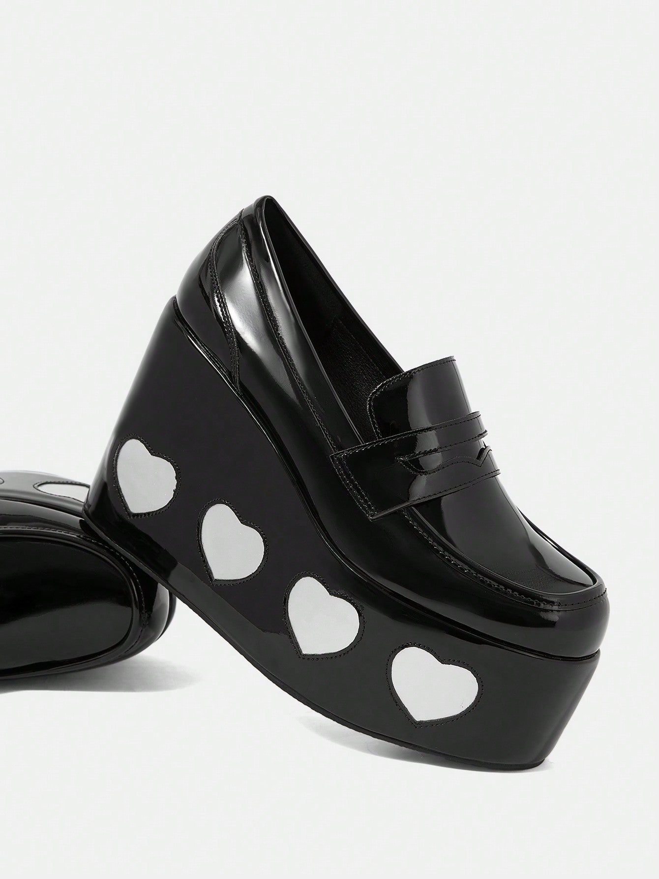 Elevate your style and comfort with our Heart Print Wedge Slip-Ons. Designed for the great outdoors, these shoes feature a heart print design and a comfortable wedge heel for added support. Stay both stylish and comfortable on your next adventure.