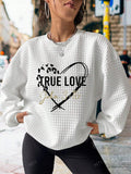 Get cozy and cute with our Heartfelt Comfort sweatshirt! Made with a waffle knit and adorned with a playful Valentine's Day letter heart print, this sweatshirt is perfect for a cozy night in or a casual outing. Spread the love and warmth with this unique piece.