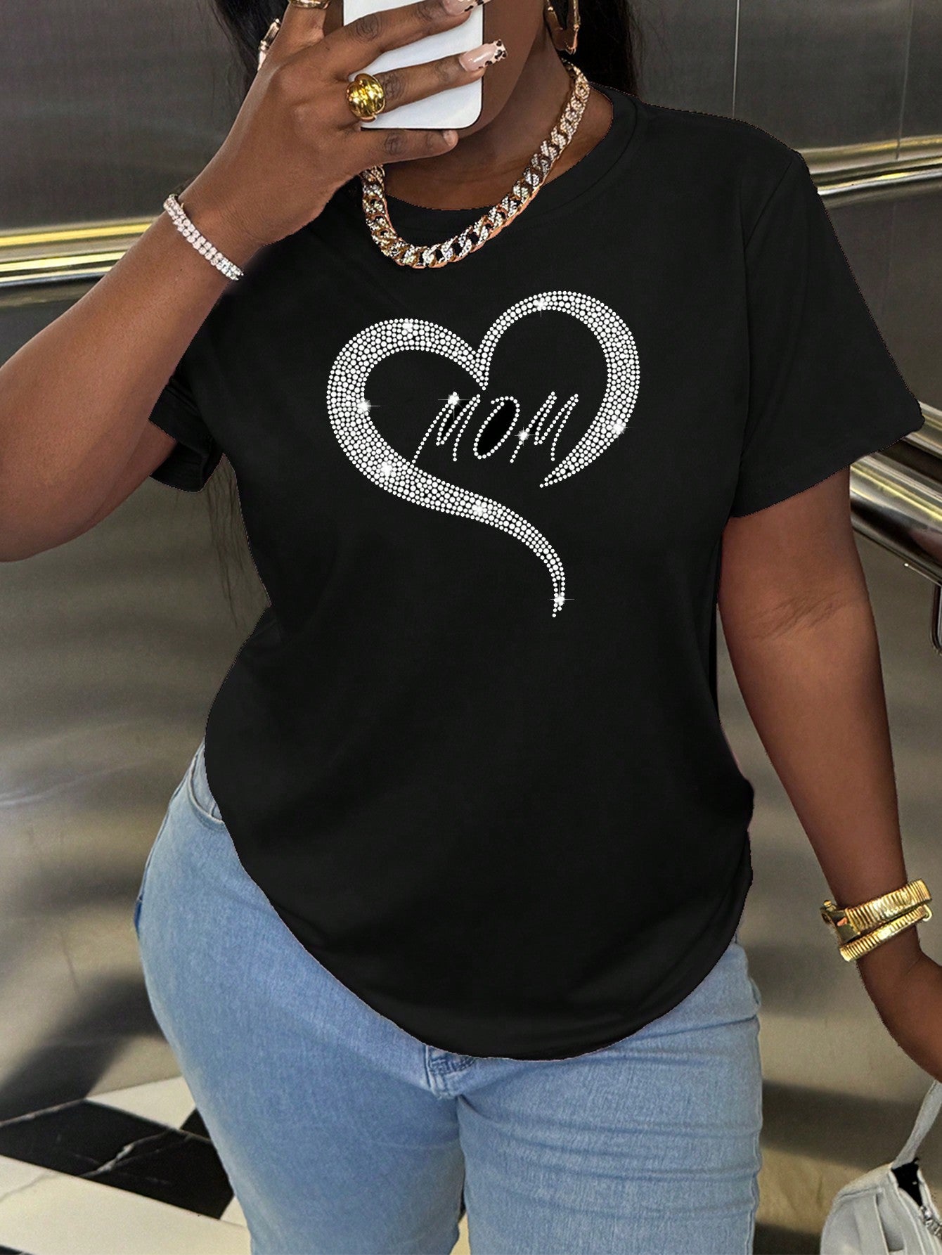 Feel elegant and comfortable with our Heartfelt Elegance black t-shirt for new moms. Adorned with sparkling crystals, this round neck top will add a touch of glamour to your everyday look. Perfect for busy moms who want to feel confident and stylish.
