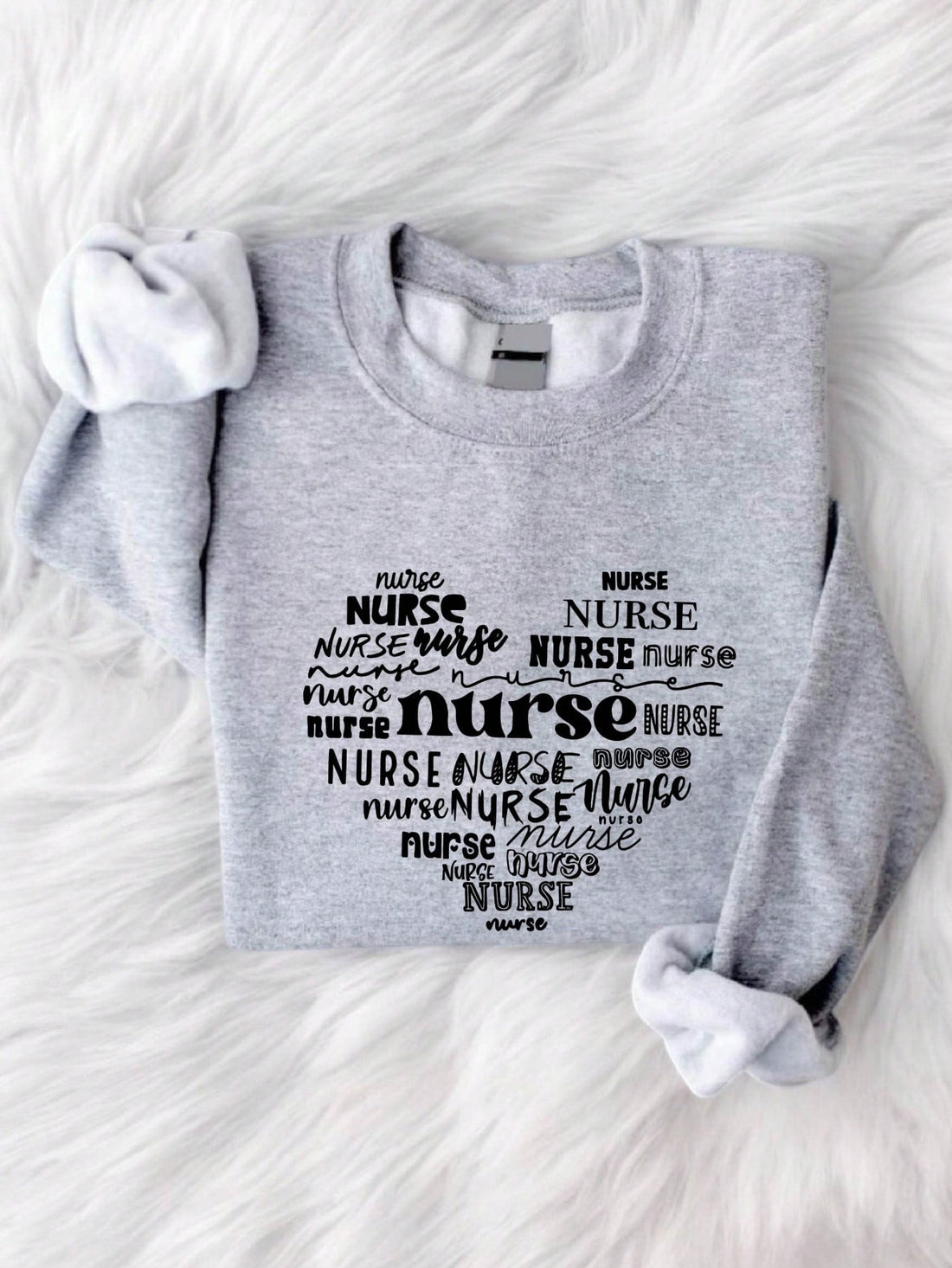 Get cozy with our Heartfelt Vibes: Cozy Valentine's Day with Nurse Heart Sweatshirt and spread love in style! Show off your appreciation for medical professionals with this adorable sweater. Perfect for Valentine's Day, or any day you want to show some heart.
