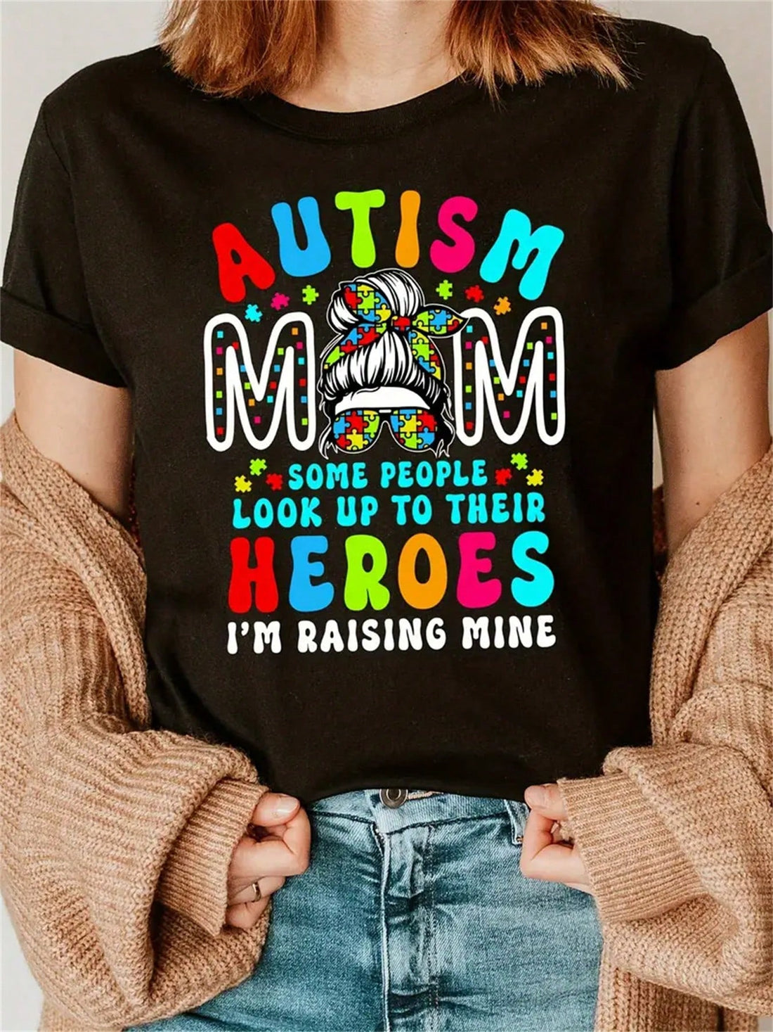 Celebrate your unique journey as a mom raising a child with autism with our Heroic Journey graphic tee. Boldly declare "I'm Raising Mine" with this quirky and playful shirt. Show your strength and pride in being an autism mom with this stylish and empowering shirt.