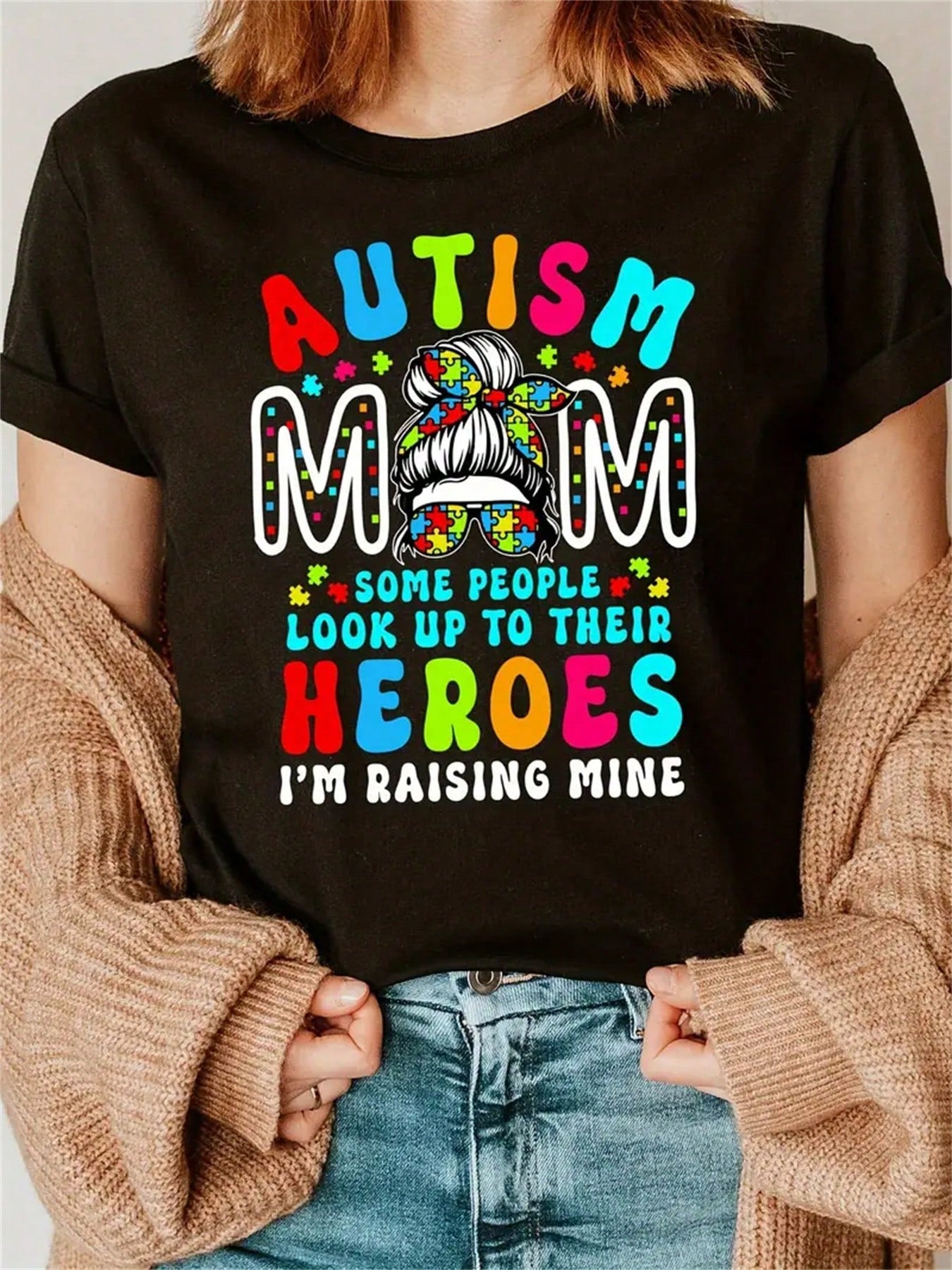 Celebrate your unique journey as a mom raising a child with autism with our Heroic Journey graphic tee. Boldly declare "I'm Raising Mine" with this quirky and playful shirt. Show your strength and pride in being an autism mom with this stylish and empowering shirt.