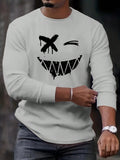 Get ready to smile! This Manfinity Homme Men's Casual Round Neck Long Sleeve T-Shirt features a playful smile print that's perfect for adding a touch of quirkiness to your wardrobe. With its soft fabric and long sleeves, it's the ideal choice for staying comfortable and stylish this autumn.