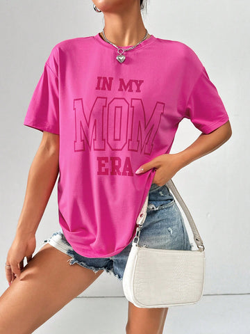 Rock your casual style with this IN MY MOM ERA graphic tee. Its loose-fit design makes it perfect for a laid-back summer look. Effortlessly stylish, this tee is a must-have for any wardrobe. Show off your unique personality with this fun and quirky shirt. (Go ahead, make your mom proud!)
