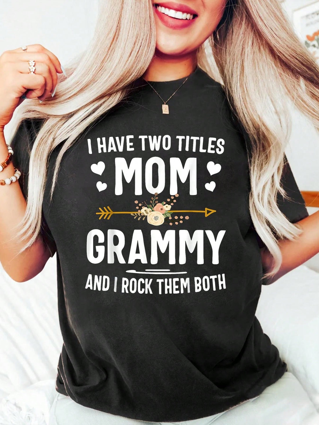 Celebrate the amazing mom and Grammy in your life with this heartfelt graphic tee. Featuring the phrase "I Have Two Titles: Mom and Grammy," this tee is the perfect gift for Mother's Day. Show your appreciation and love with this quirky and fun shirt.