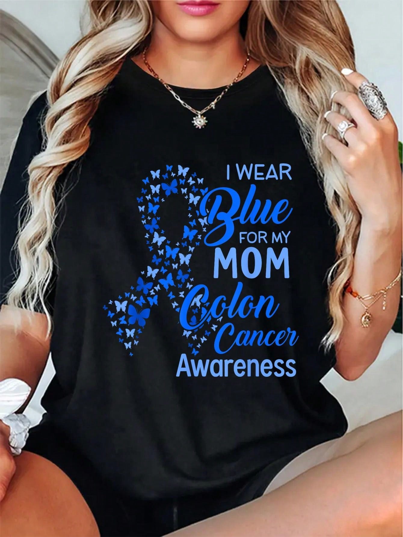Show your support for Colon Cancer Awareness with this quirky and playful cotton t-shirt! The "I Wear Blue for My Mom" slogan adds a personal touch and helps raise awareness for a great cause. Comfortable and stylish, wear it with pride.