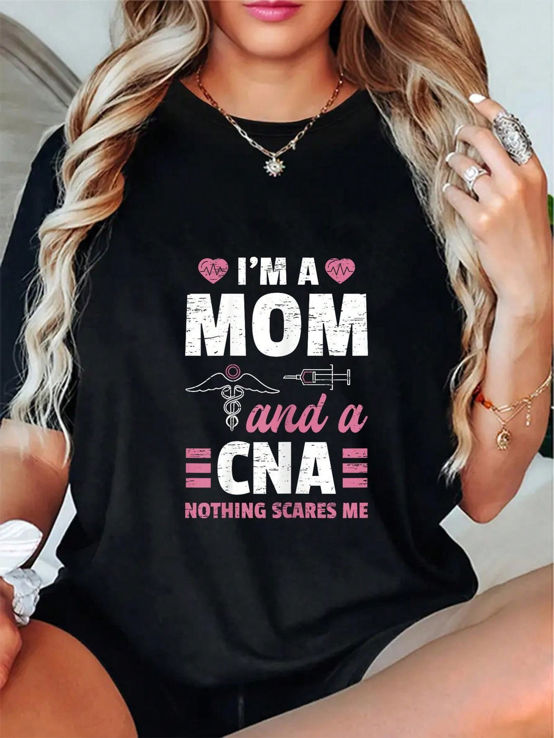 Introducing our "I'm a Mom and a CNA" tee, perfect for all the fearless nursing moms out there! With a touch of humor, this tee shows off the dedication and strength of being both a mom and a certified nursing assistant. Embrace your superpowers with this quirky and fun shirt!