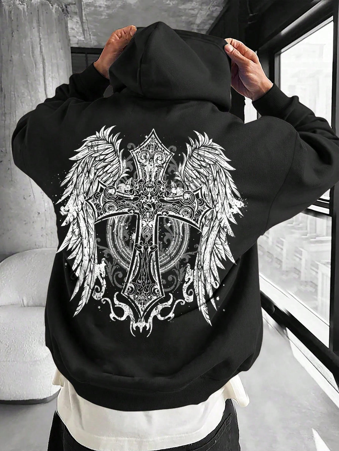 Introducing the ultimate street style hoodie for men. The black sweatshirt features a vintage gothic angel wings and cross design, perfect for adding a touch of edginess to your wardrobe. Made with quality materials, this hoodie provides both style and comfort.