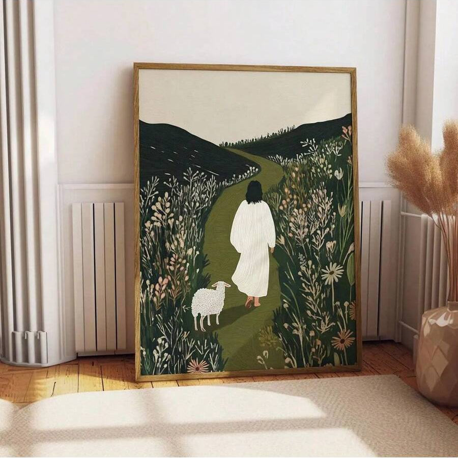 Good Shepherd canvas wall art with a robed figure and white sheep on a green path