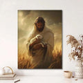 Portrait canvas wall art of Jesus holding a white lamb among golden wheat, displayed above a console in a bright neutral room