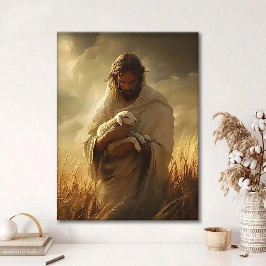 Portrait canvas wall art of Jesus holding a white lamb among golden wheat, displayed above a console in a bright neutral room