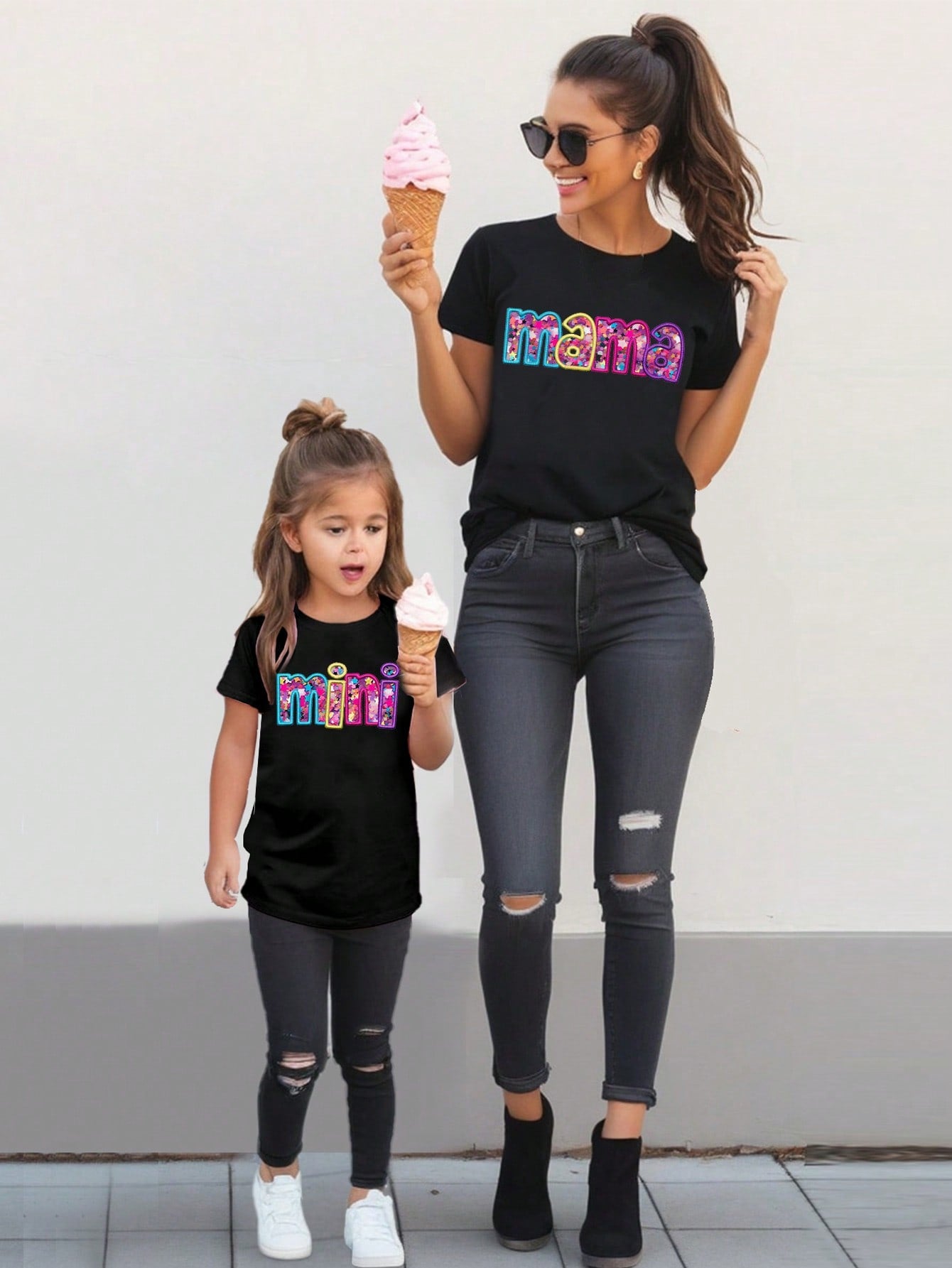 Get ready to spread joy with the Joyful Duo: Mom & Daughter Matching Colorful Letter Slogan T-Shirts. These quirky and fun t-shirts feature colorful letters that will brighten up your wardrobe. Perfect for bringing a smile to your and your daughter's faces, these shirts are a must-have for any playful pair!