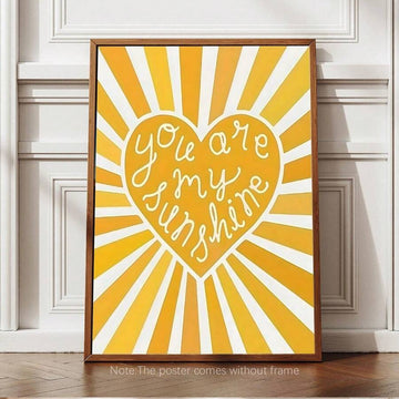 Brighten any room with this cheerful 'You Are My Sunshine' canvas wall art. Featuring a vibrant yellow heart and uplifting message, this piece brings warmth and positivity to bedrooms, nurseries, living spaces, and offices. The graphic design combines playful lettering with bold colors that appeal to all ages—perfect for children's rooms, family spaces, or as a thoughtful gift. Made from durable non-woven fabric, it's lightweight and easy to hang. Ideal for spring and summer décor, celebrations, baby shower