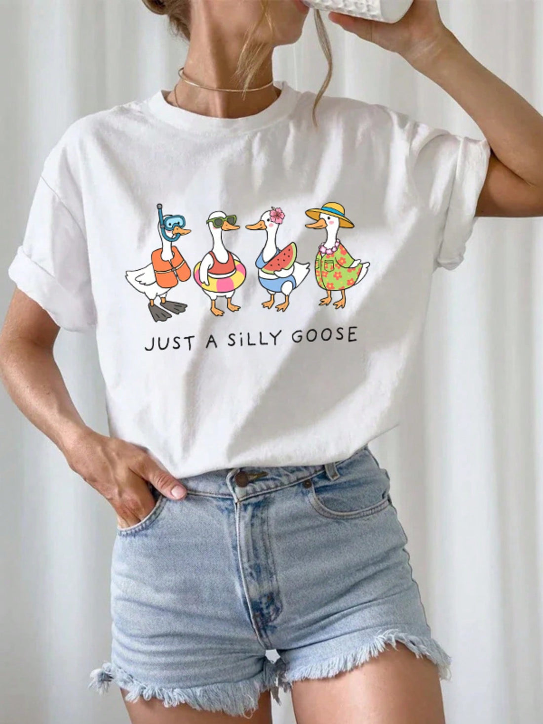 Embrace your playful side with this Just A Silly Goose Graphic T-Shirt, perfect for sunny days and casual hangouts. Its lively design adds a touch of whimsy to your outfit, while the comfortable fit keeps you cool and relaxed all summer long. Whether you're out with friends or enjoying a laid-back weekend, this tee brings fun and effortless style together.