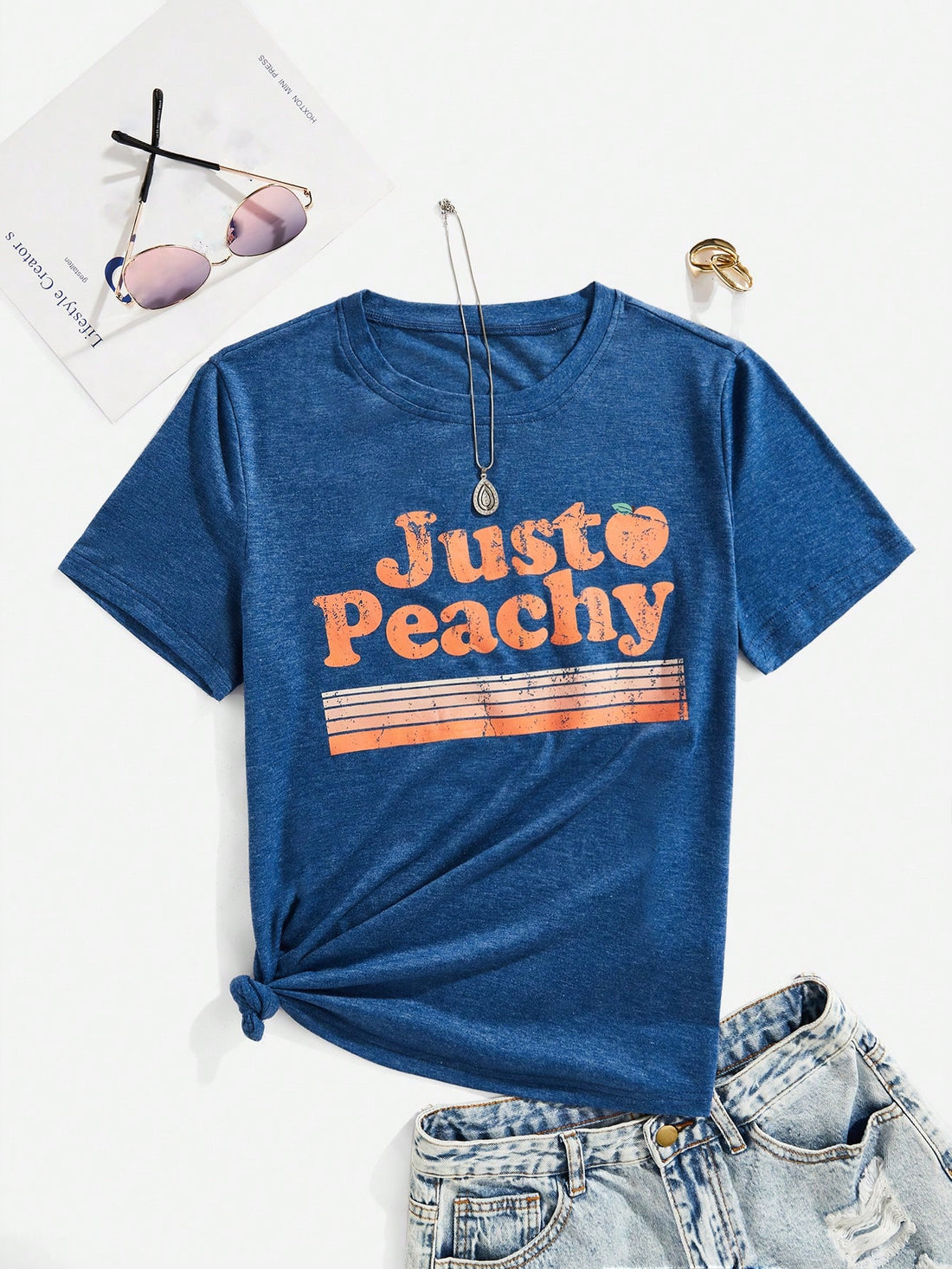Add a touch of playful style to your wardrobe with our Just Peachy Graphic Tee! With its effortless style, this tee is perfect for any occasion. Stand out in a sea of basic t-shirts with our unique letter design. Stay comfortable and trendy all day long!