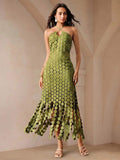 Front view of olive-green halter maxi dress with keyhole neckline and linked-disc fringe
