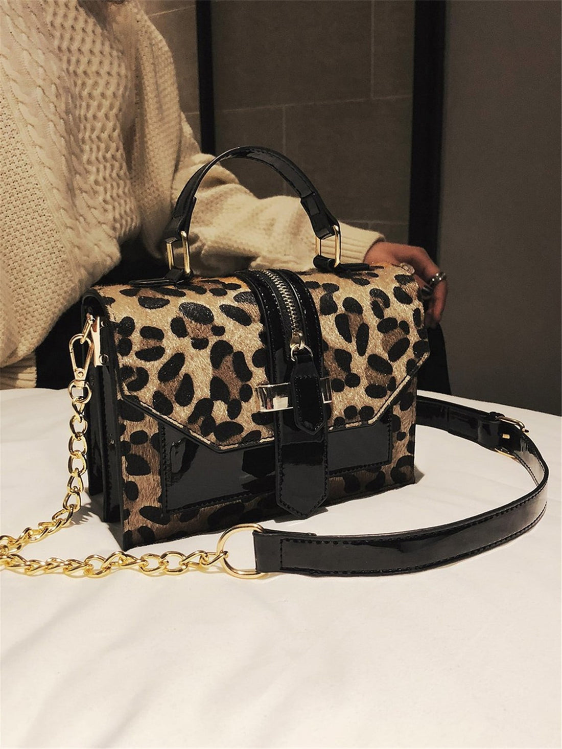 Introducing our Leopard Print Chain Flap Square Bag, the ultimate must-have accessory for on-the-go women. Featuring a trendy leopard print and a chic chain strap, this bag will elevate any outfit. Stay stylish and organized with this versatile and fashionable bag.