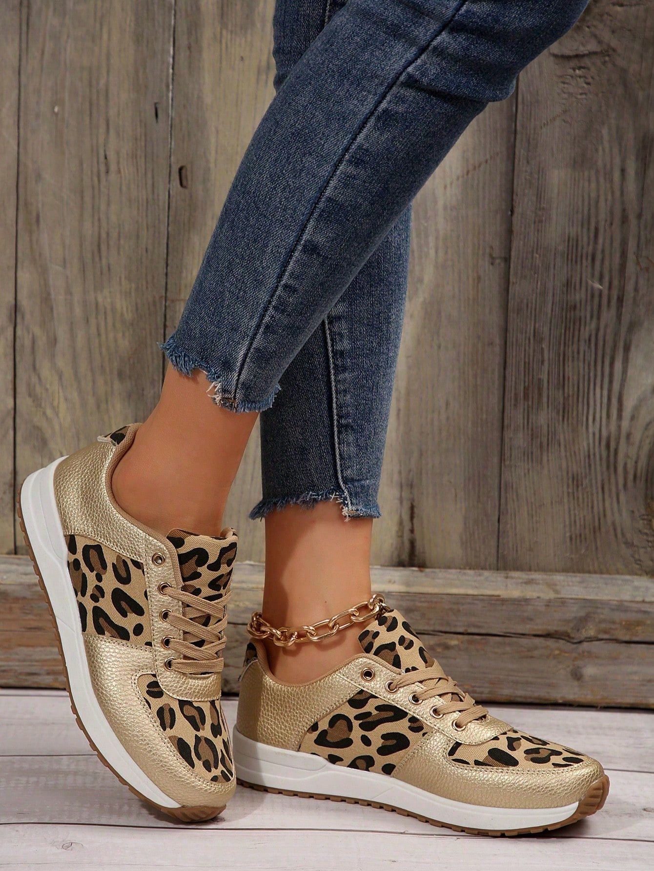 Upgrade your casual and commuting wardrobe with our Leopard Print Lace-Up Sneakers. These stylish sneakers not only feature a trendy leopard print, but also provide unbeatable comfort for all-day wear. Perfect for any occasion, step out in style with confidence.