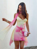 Front view of pink yellow floral scarf mini dress showing visible color, trim, and silhouette