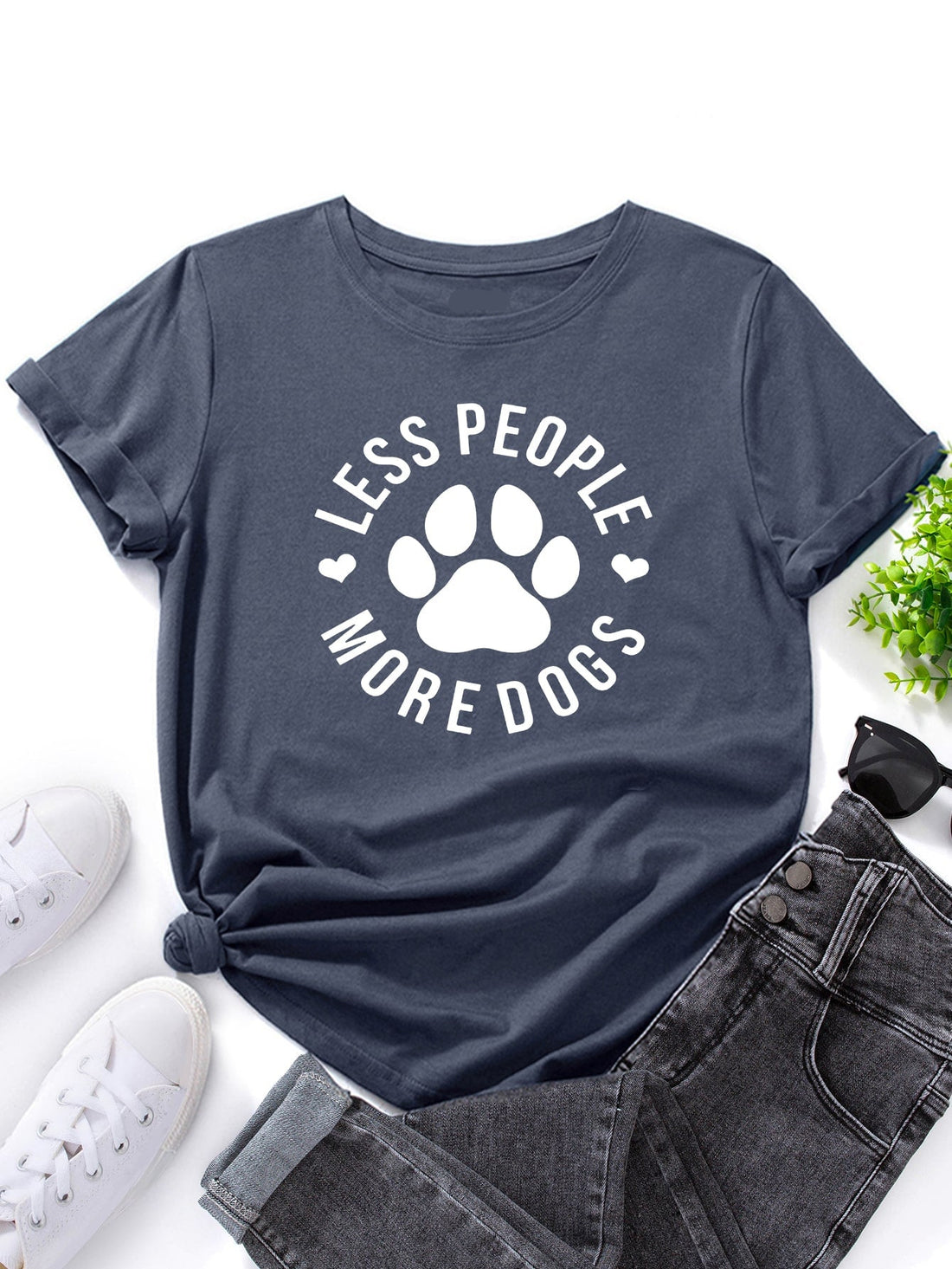 Unleash your love for dogs with our "Less People, More Dogs" graphic tee! Perfect for dog lovers, this shirt features a playful paw print design. Get ready for compliments (and wagging tails) wherever you go! Woof! (Only available in English)