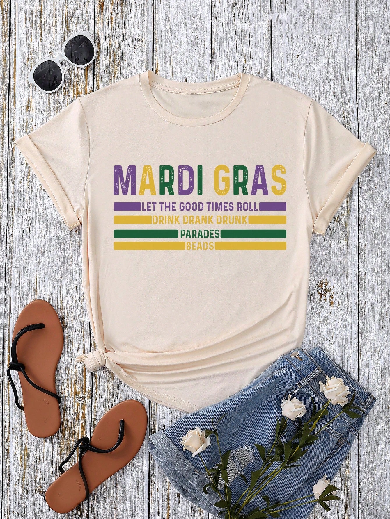 Get ready to roll with the fun and carefree Let the Good Times Roll T-Shirt! Perfect for summer, this casual round neck shirt is perfect for carnival season. Join in on the good times with this playful, quirky shirt.