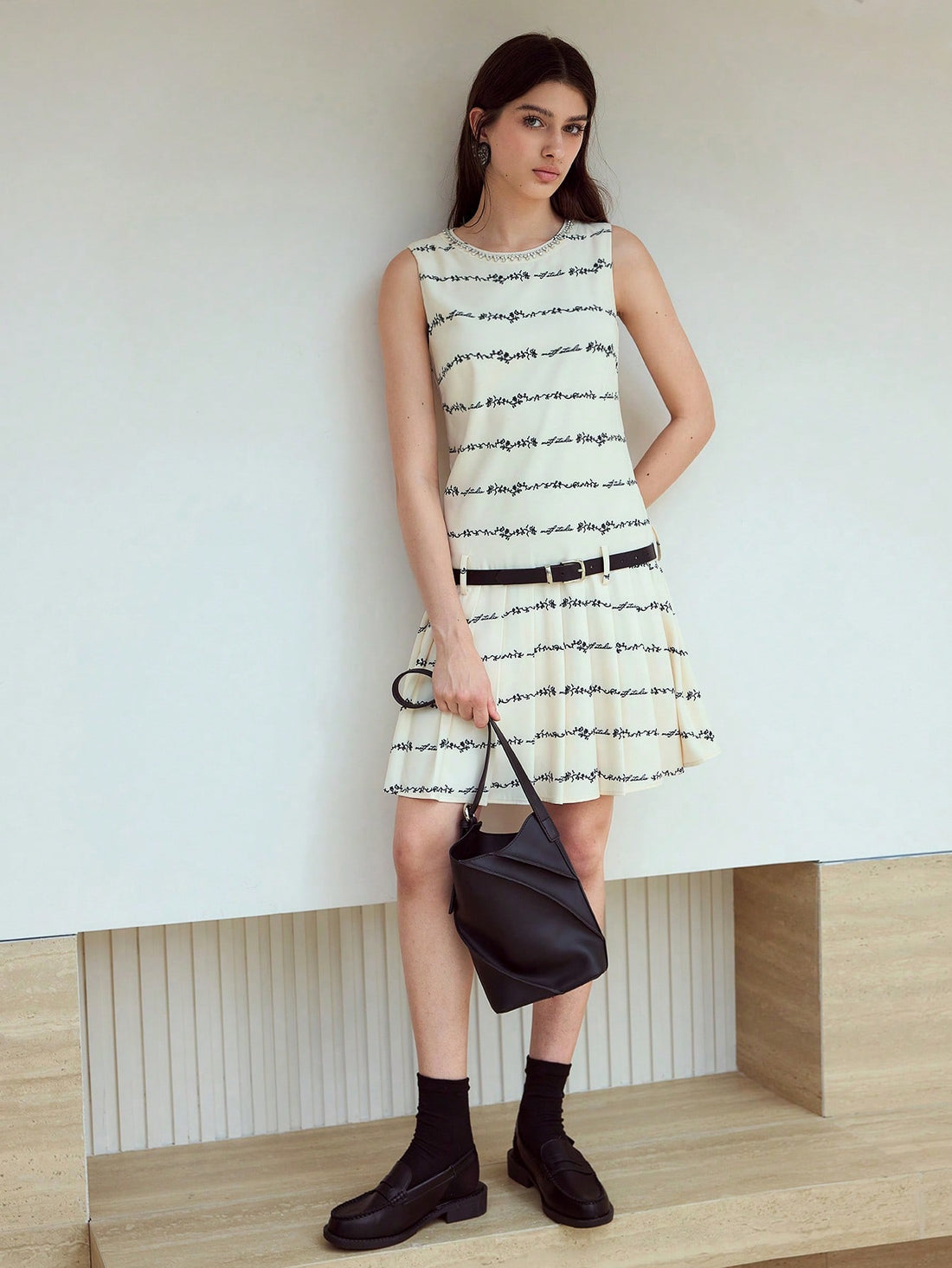 Step out in style with the Letter Graphic Fold Pleated Dress, where playful design meets modern flair. Its unique fold and pleat details create a dynamic silhouette that moves with you, while the bold letter graphics add a fun, contemporary edge. Perfect for turning heads at any event, this dress combines comfort and creativity for a look that’s as lively as you are.