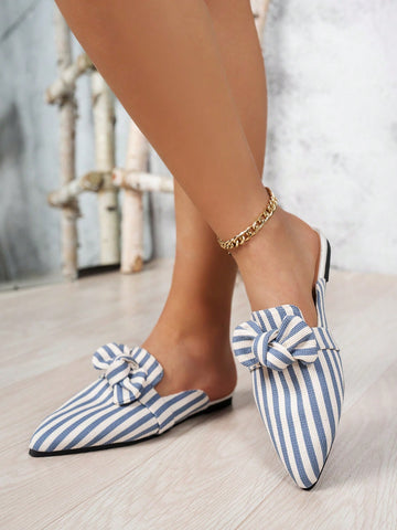 Slip into style with these adorable light blue bowknot mule slippers! The vertical stripes add a fun touch to these comfortable and stylish plus size slippers. Perfect for both indoor and outdoor leisure activities.