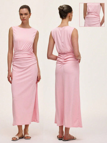 This light pink sleeveless dress features a flattering ruched waist that hugs your curves just right. The stylish round neck adds a chic touch, making it perfect for sunny days or casual outings. Easy to wear and effortlessly cute, it’s your new go-to for playful, feminine style.