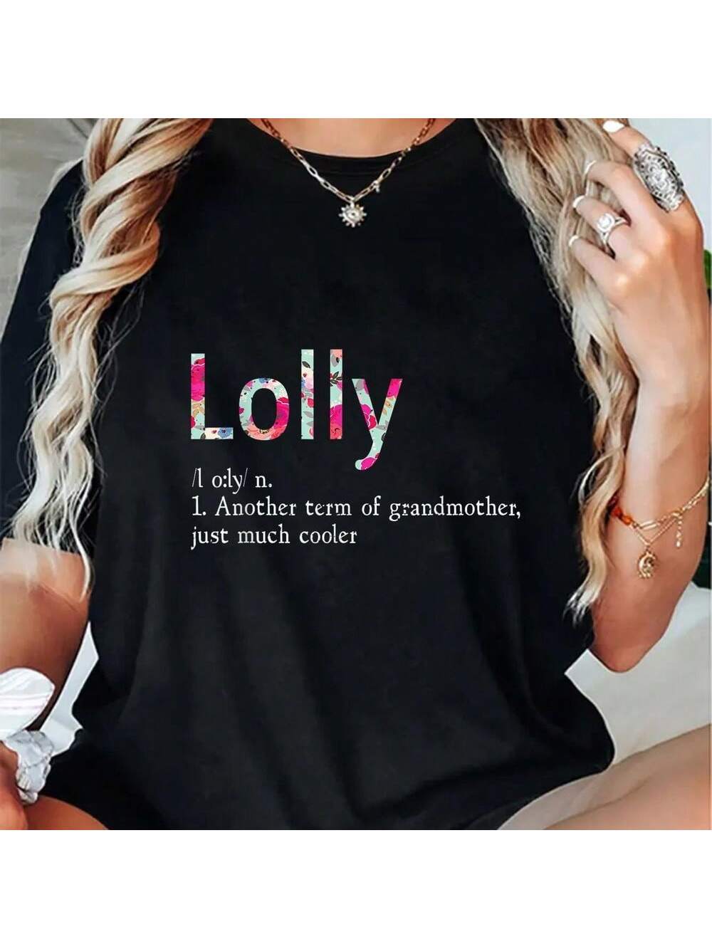 Get ready to impress your favorite grandmother with the Lolly Cool Grandma Floral T-Shirt! This shirt is sure to make her feel cool and loved, with a fun floral design and a sweet message. Great for any occasion, this shirt is the perfect gift for any grandma who's young at heart.