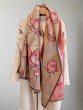 Introducing our luxurious Lotus Floral Bliss Imitation Cashmere Scarf, the must-have fashion accessory for the Fall/Winter season. Made with soft and durable imitation cashmere, this versatile scarf features a beautiful lotus floral design that will elevate any outfit. Stay warm and stylish with this essential piece.