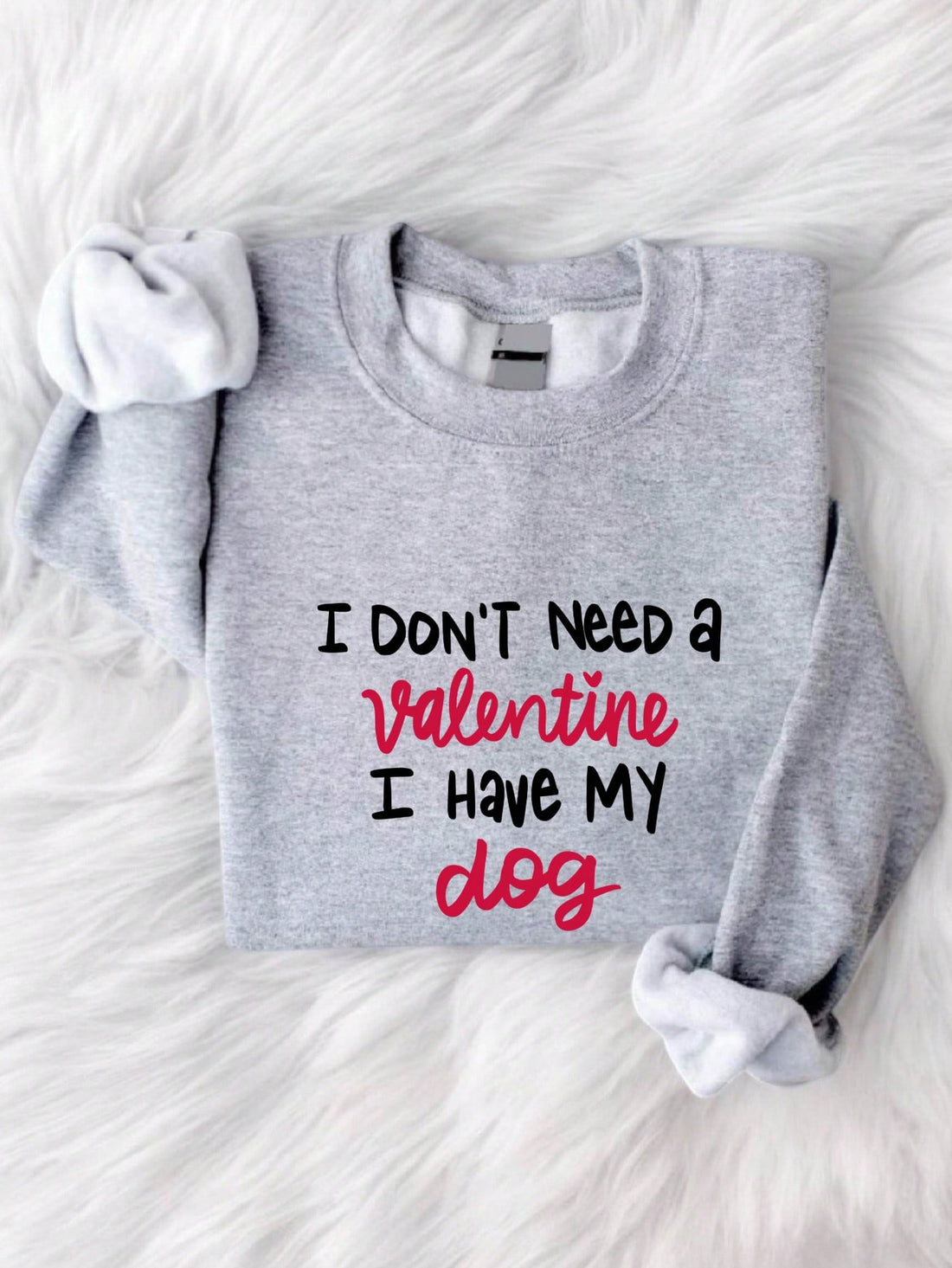 Embrace the love-filled holiday in our cozy and chic "I Don't Need A Valentine I Have My Dog" sweatshirt. Perfect for cuddling up with your furry companion, this sweatshirt will keep you warm and stylish as you create romantic moments with your four-legged friend. Who needs a Valentine when you have your loyal and loving dog by your side?