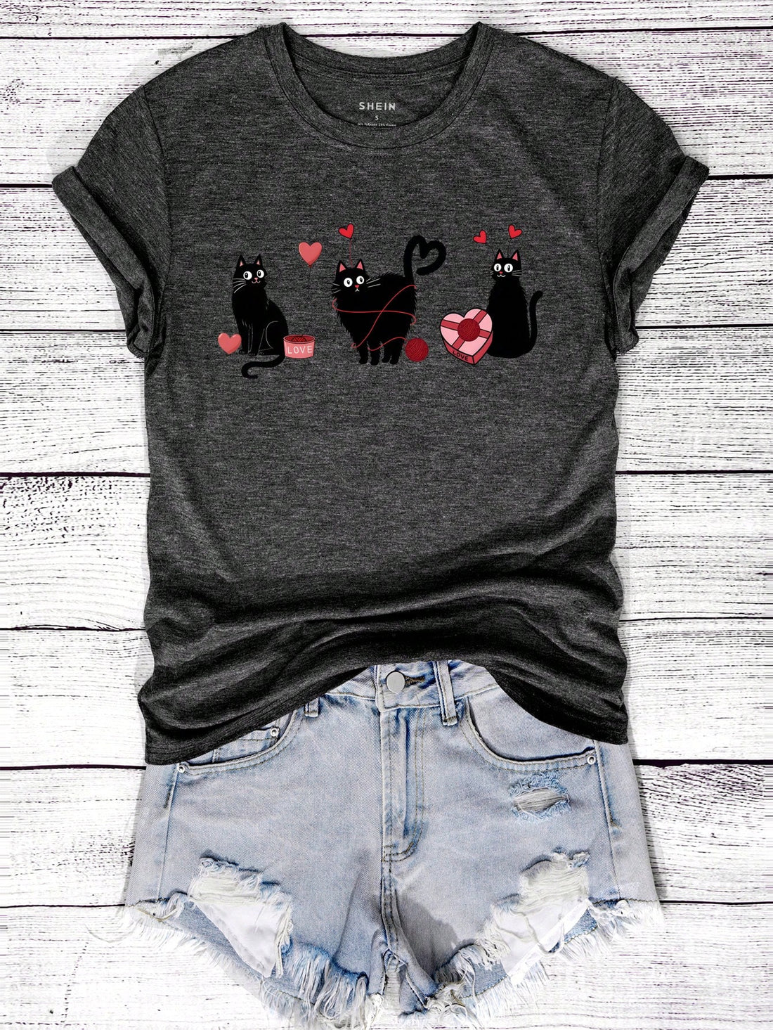 Show your love for cats in a quirky way with our Love Feline Style t-shirt. Featuring a cute black cat graphic, this shirt is purrfect for Valentine's Day. Let your style meow-loud as you celebrate the holiday with this playful and unique t-shirt.