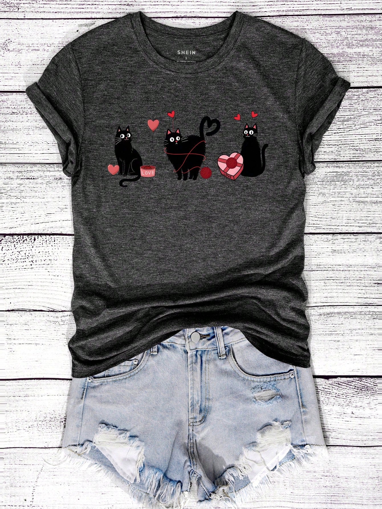 Show your love for cats in a quirky way with our Love Feline Style t-shirt. Featuring a cute black cat graphic, this shirt is purrfect for Valentine's Day. Let your style meow-loud as you celebrate the holiday with this playful and unique t-shirt.