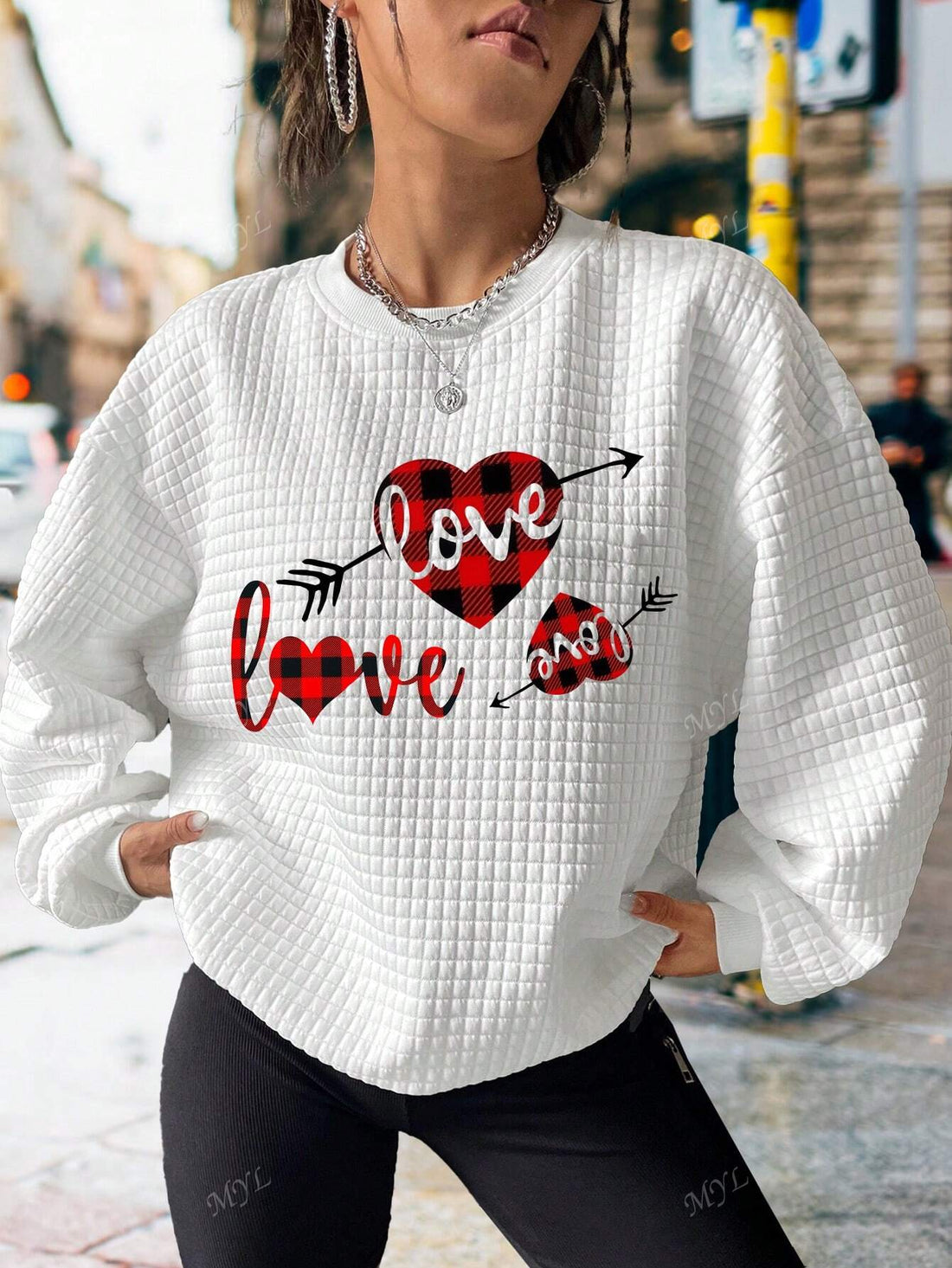Show off your love and comfort with this adorable Valentine's Day sweatshirt. Made with soft and cozy material, it's perfect for cuddling with your sweetheart or lounging around on a chilly February day. Spread love and stay cozy with Love in Comfort!