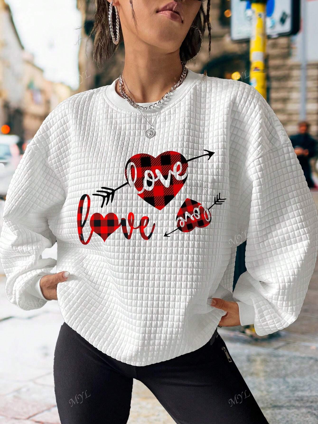 Show off your love and comfort with this adorable Valentine's Day sweatshirt. Made with soft and cozy material, it's perfect for cuddling with your sweetheart or lounging around on a chilly February day. Spread love and stay cozy with Love in Comfort!