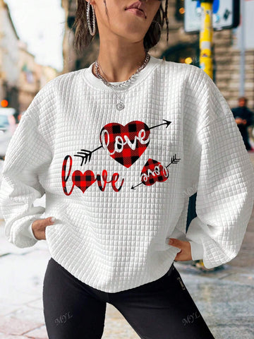 Show off your love and comfort with this adorable Valentine's Day sweatshirt. Made with soft and cozy material, it's perfect for cuddling with your sweetheart or lounging around on a chilly February day. Spread love and stay cozy with Love in Comfort!