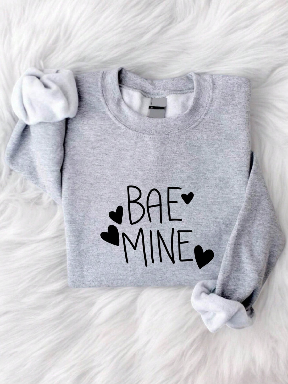 Spread the love this Valentine's Day with our "Love is in the Air" sweatshirt! Stay cozy and stylish while declaring your love. Be the perfect "mine" for your special someone with this quirky and fun sweatshirt. Don't wait any longer, grab one now! (Only 40 words, darling!)